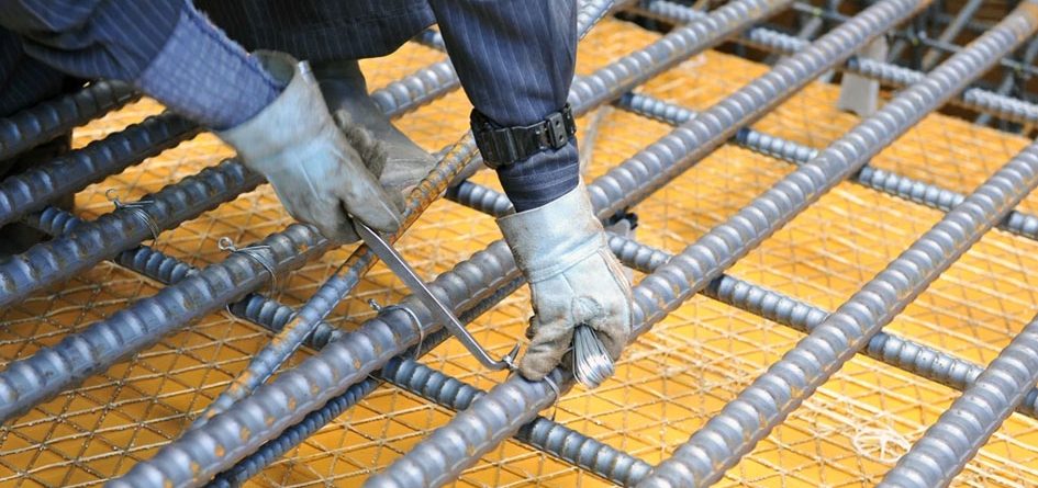 Worker tying rebar with Prakash binding wire